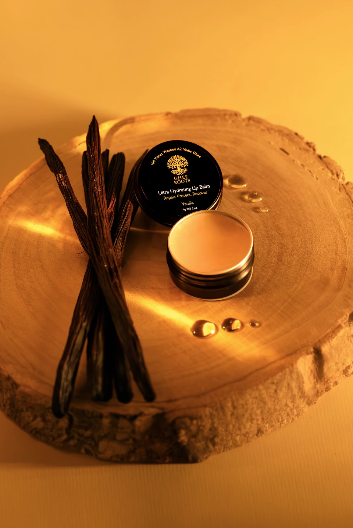 Open Vanilla Ultra Hydrating Lip Balm with vanilla pods